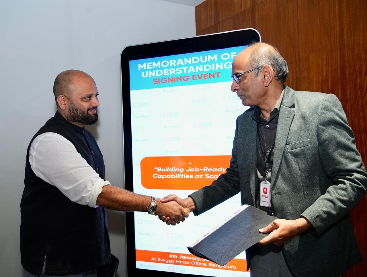 Mr. V.L.V.S.S. Subba Rao, Vice Chancellor, Young India Skills University (YISU), Telangana, and Girish Menon, Chief Human Resources Officer, Swiggy Ltd, at the signing of an MoU to create over 5,000 career opportunities in quick commerce for youth in Telangana.